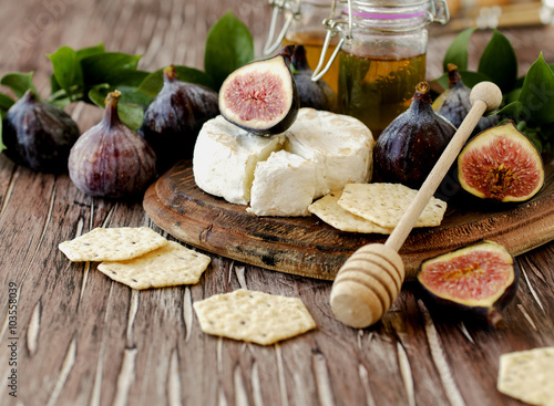 figs with cheese and honey , selective focus