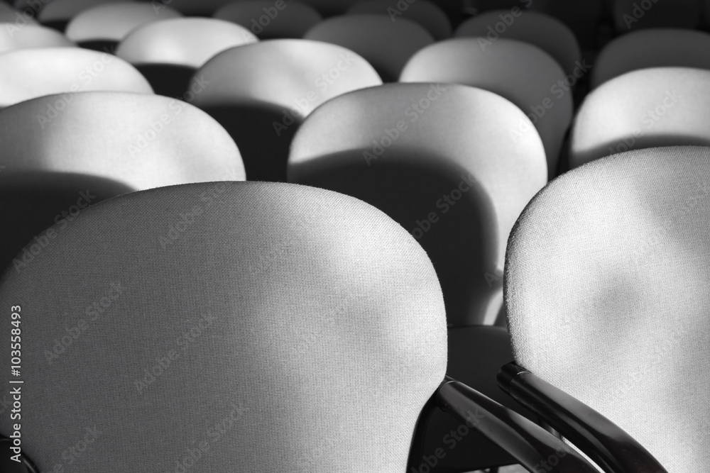 Obraz premium Gray armchairs in a rows, empty auditorium interior