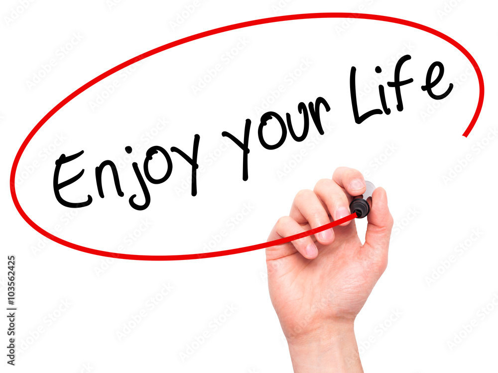 Man Hand writing Enjoy your Life with black marker on visual scr Man Hand writing Enjoy your Life with black marker on visual scr
