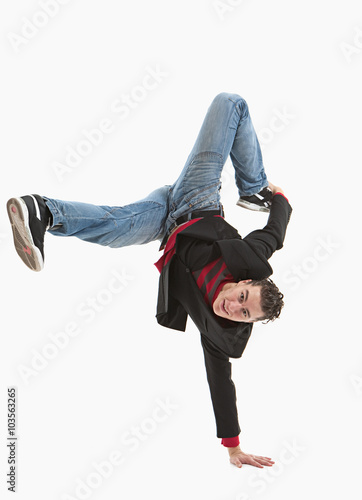 Young guy is dancing. Street dance. White background.