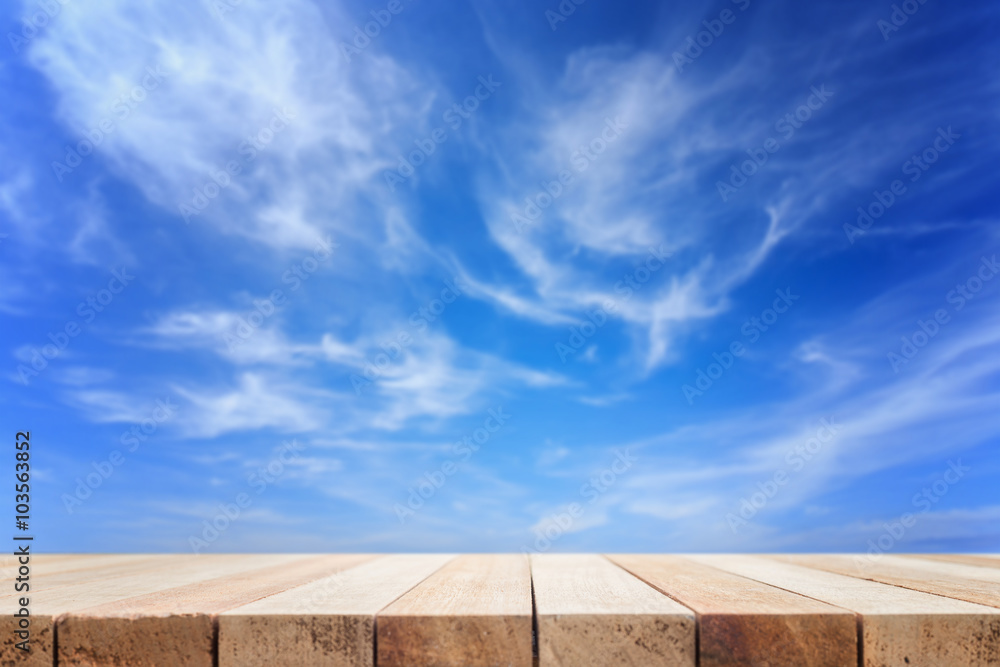 Empty top of wooden table or counter and view sky Empty top of wooden table or counter and view sky