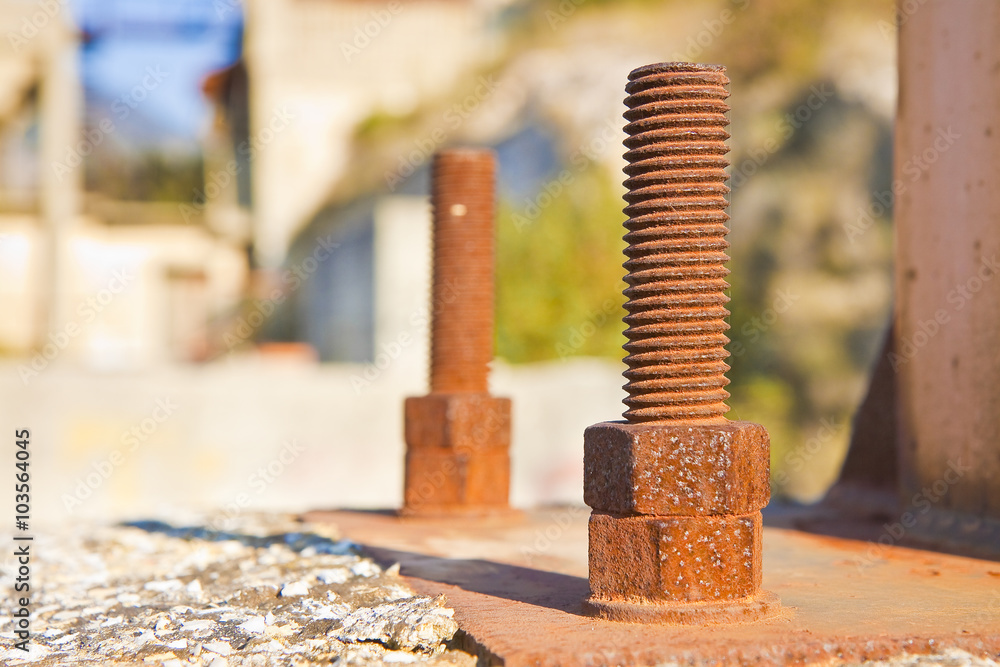Old rusty anchor bolt with iron plate - image with copy space Old rusty anchor bolt with iron plate - image with copy space
