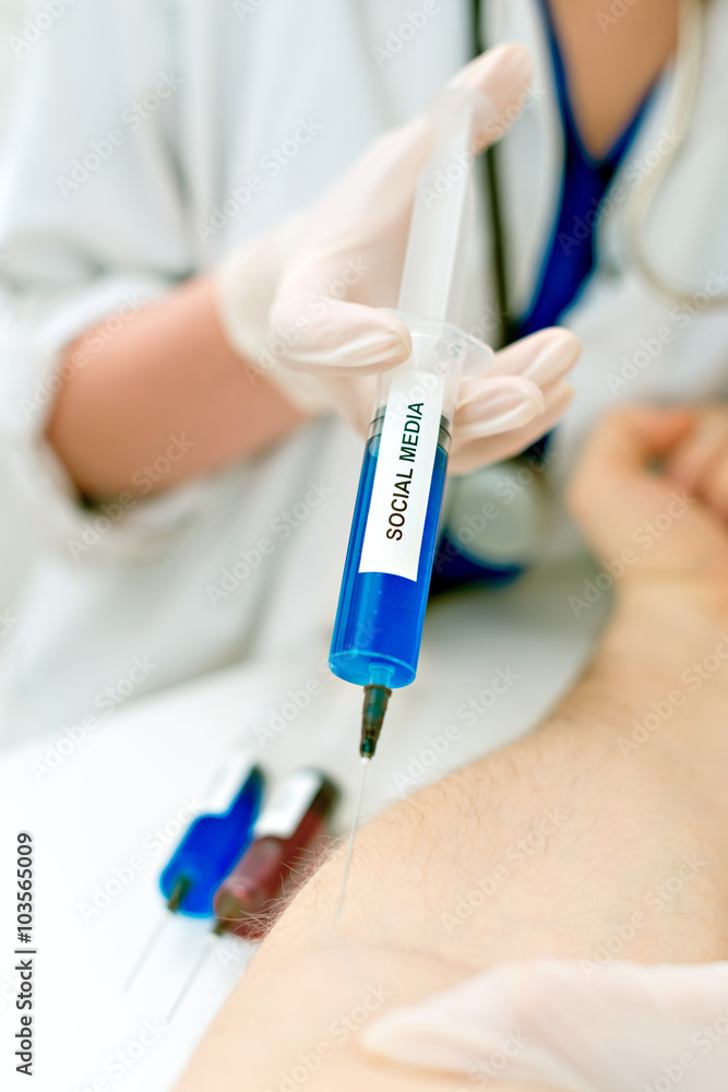 Obraz premium Doctor injecting patient with syringe. Social media addiction concept.