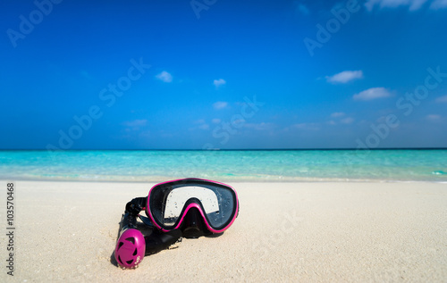 Colorful snorkel mask by the sea, remote tropical beaches. Trave