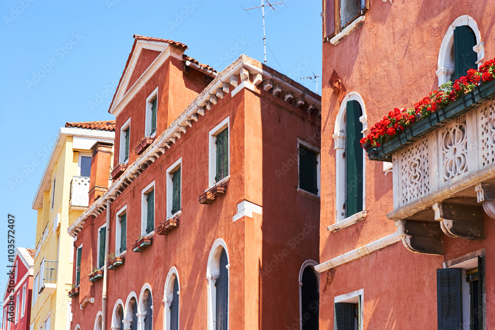 Colorful facades of old medieval houses in Venice, Italy.