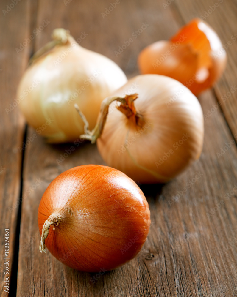 Onions and peel on an old rural table Onions and peel on an old rural table