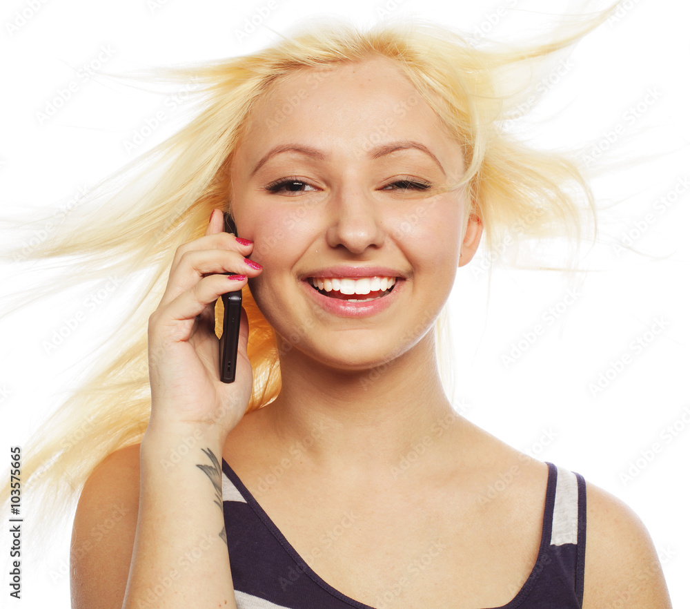 Fototapeta premium Pretty young woman using mobile phone