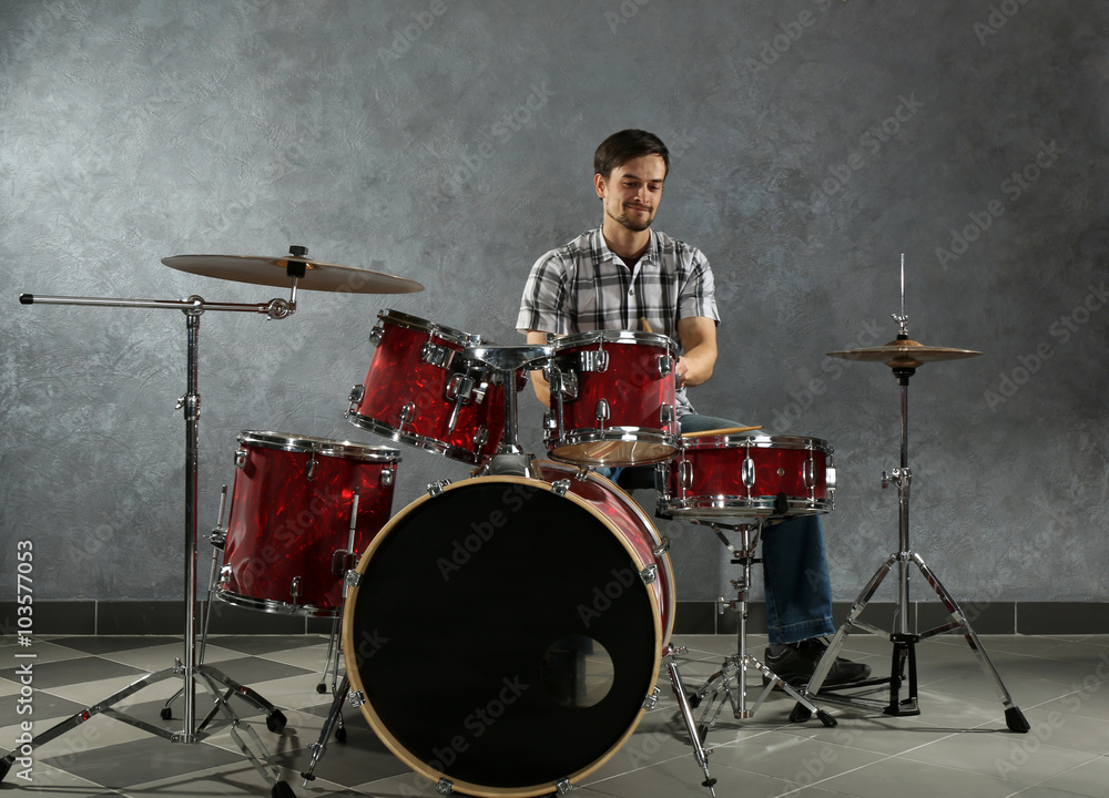 Fototapeta premium Musician playing the drums in a studio