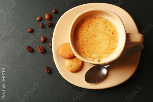 Cup of coffee on gray background © Africa Studio