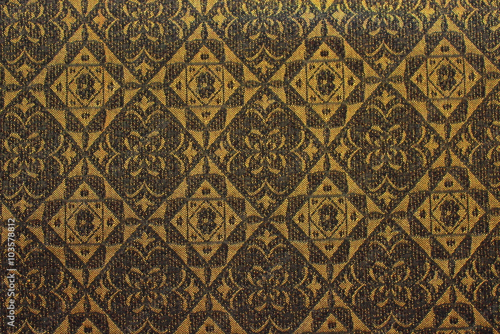 background batik brown and gold patterned square and round