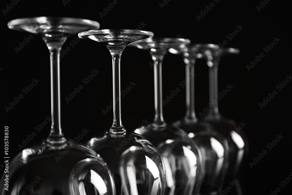 Empty wine glasses on black background, closeup Empty wine glasses on black background, closeup