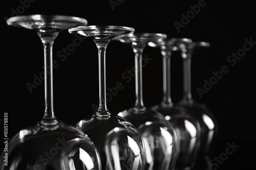 Empty wine glasses on black background, closeup