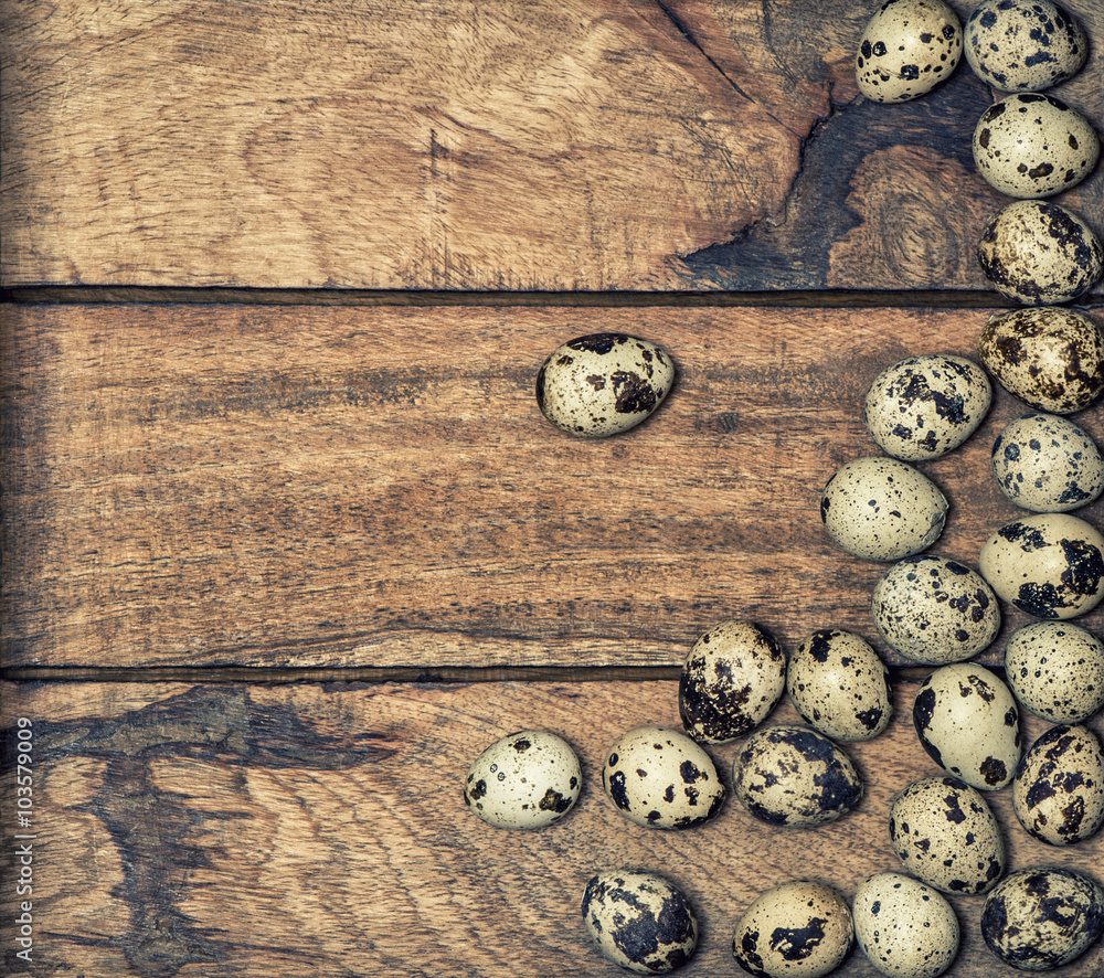 Quail eggs on wooden background. Retro style toned Quail eggs on wooden background. Retro style toned