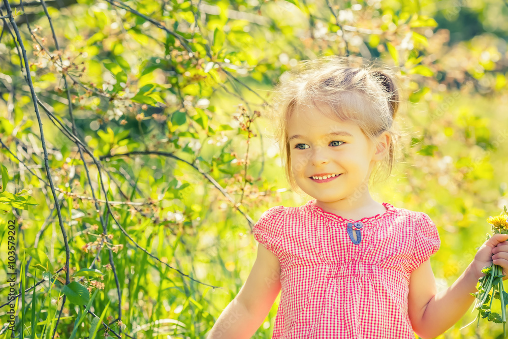 Happy little girl playing in sunny park Happy little girl playing in sunny park