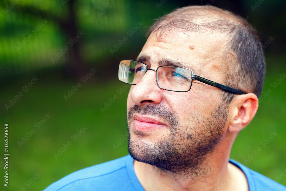portrait of young man with bad eyesight and hair loss. portrait of young man with bad eyesight and hair loss.