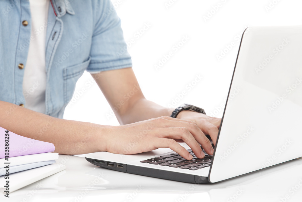 Fototapeta premium man typing on a laptop