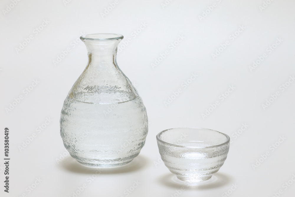 Sake cup and bottle on white background Sake cup and bottle on white background