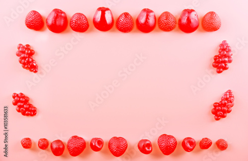 Fruit candies on pink background