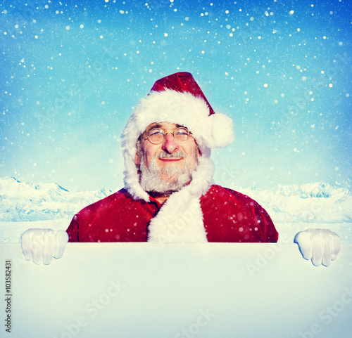  Santa Claus Holding a Blank Sign Snowing Concept © Rawpixel.com