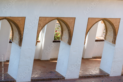 Arch of white building in the Generalife palace. Granada. Spain