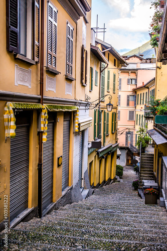 Narrow street in Bellagio. Lake Como. Northern Italy. European travel, vacation, summer, destination, exploration and lifestyle concept. photo