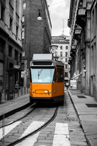 Tram in Milan. Monochrome. Selective color. European travel, lifestyle, vacation and transportation concept.