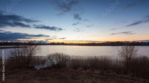 Beautiful sunset over calm lake