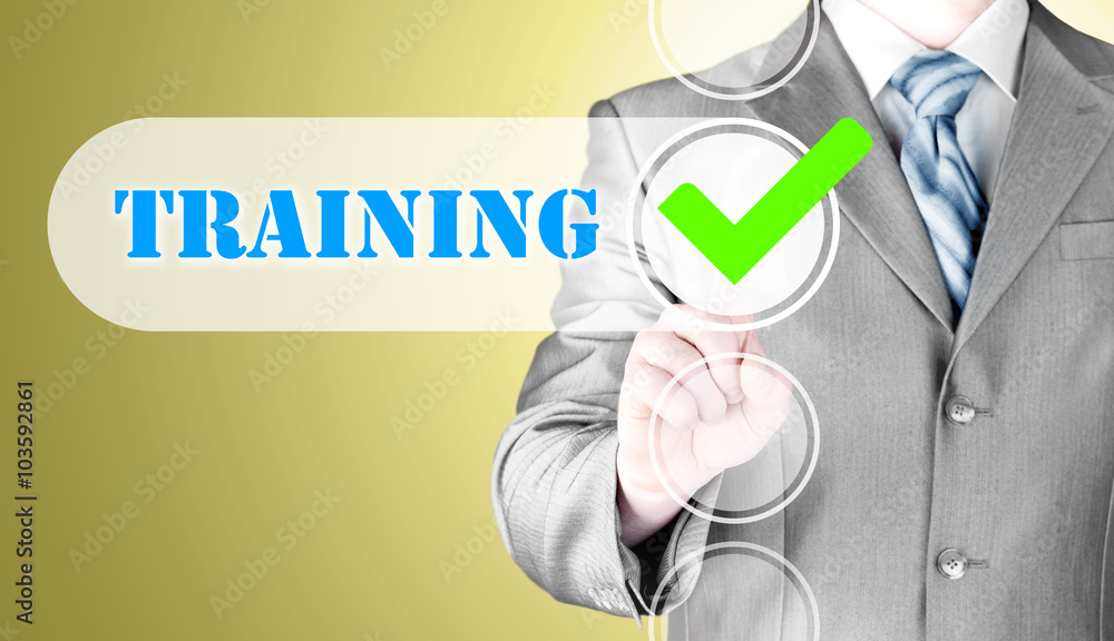 Businessman pressing touch screen interface training checkbox Businessman pressing touch screen interface training checkbox