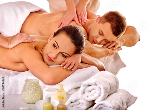 Loving couple getting massage in spa . Isolated.