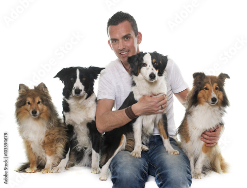 four beautiful dogs and man
