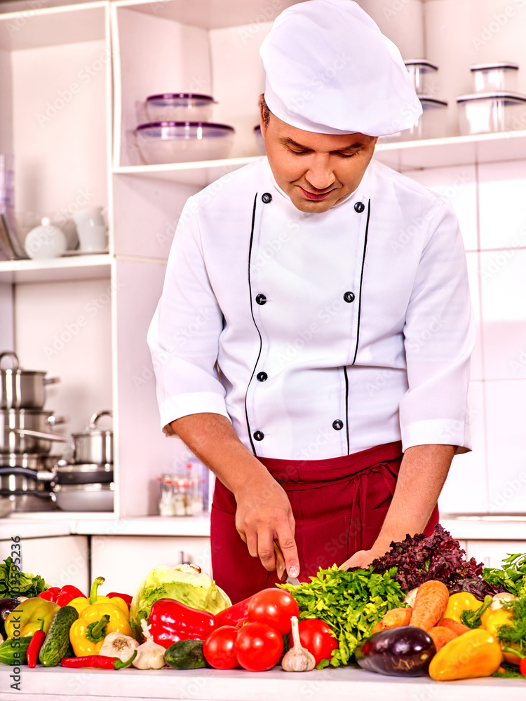 Happy man professional in chef hat cooking . Happy man professional in chef hat cooking .