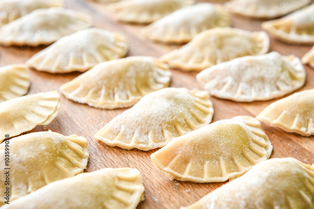 Making of homemade dumplings pastry tortellini or ravioli