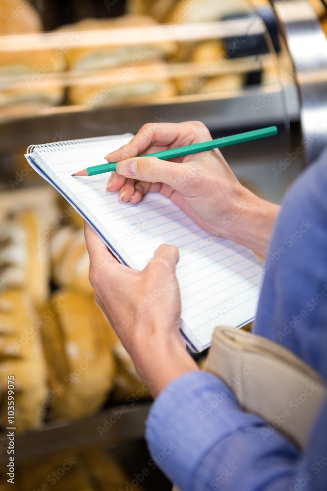Woman checking her shopping list Woman checking her shopping list