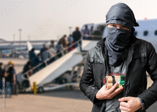 Fotografie Terrorist has dynamite bomb in jacket in airport