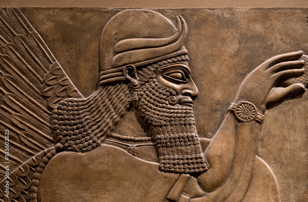 Naklejka premium Ancient relief of an assyrian god