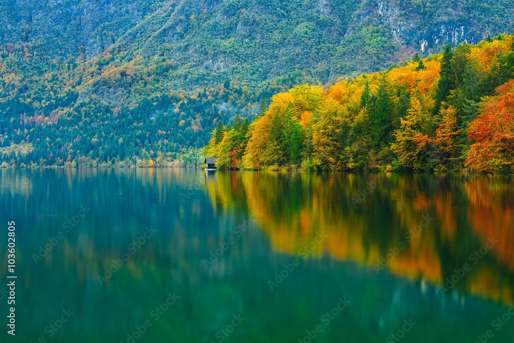 Breathtaking scenery of mountains, forests and lake with colorful reflections. Bohinj lake, Slovenia, Europe. Triglav national park. Breathtaking scenery of mountains, forests and lake with colorful reflections. Bohinj lake, Slovenia, Europe. Triglav national park.