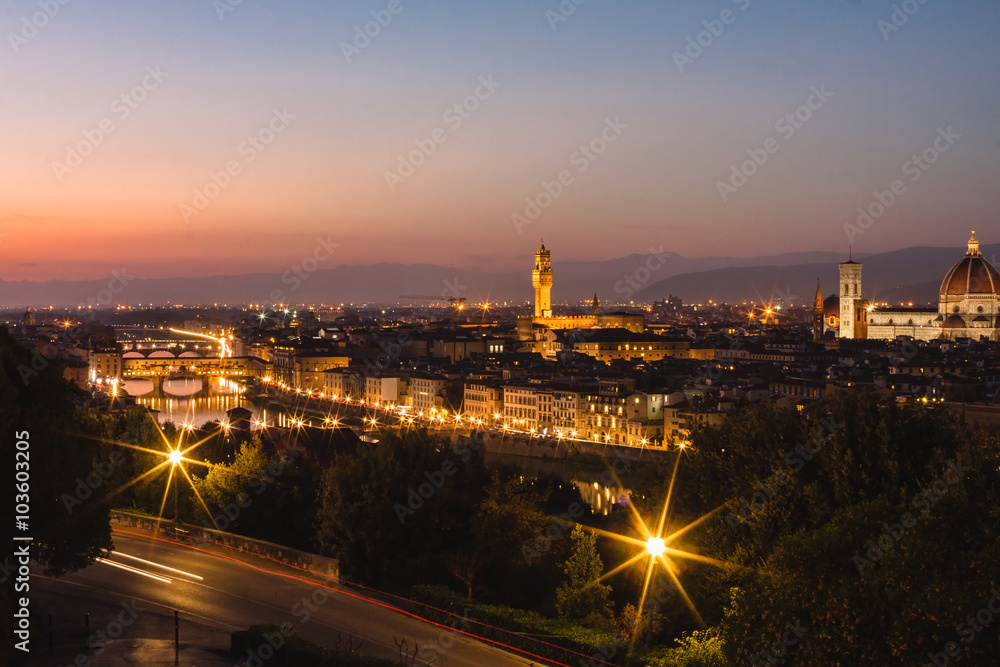 Panoramic view to the river Arno, with Ponte Vecchio, Palazzo Vecchio and Cathedral of Santa Maria del Fiore (Duomo) at dusk time. Florence, Italy