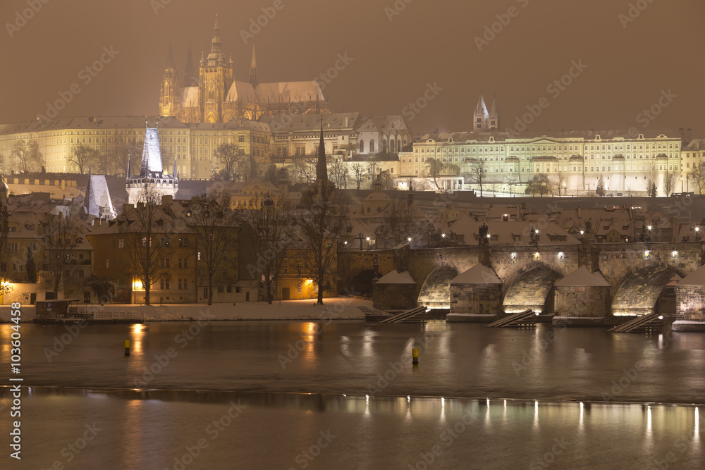 Night romantic snowy Prague gothic Castle with Charles Bridge, Czech republic