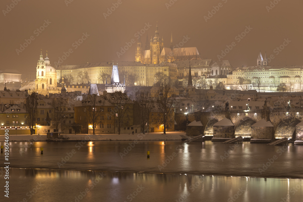 Night romantic snowy Prague gothic Castle with Charles Bridge, Czech republic