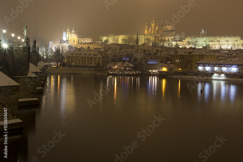 Night romantic snowy Prague gothic Castle with Charles Bridge  Czech republic