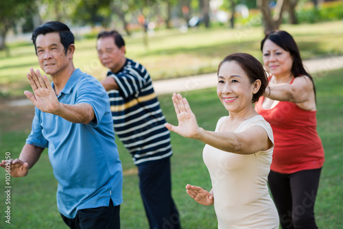 Exercising Vietnamese seniors © DragonImages