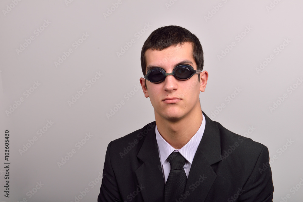 Successful businessman wearing goggles for water, thinking at va Successful businessman wearing goggles for water, thinking at va