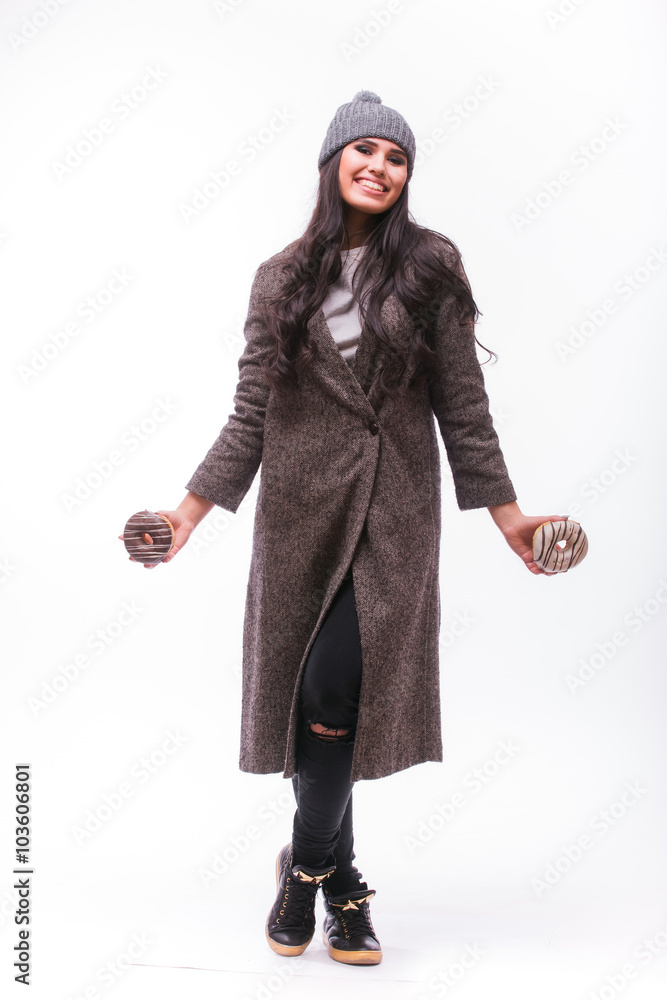 Beautiful sensual woman having fun with donuts full height on white background. Series of photos. Beautiful sensual woman having fun with donuts full height on white background. Series of photos.