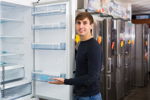 Man choosing new refrigerator