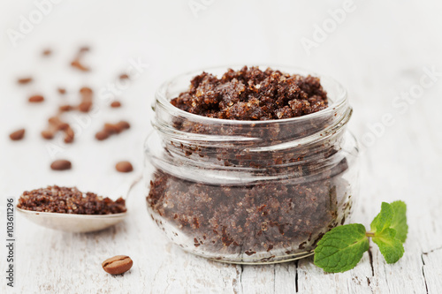 Konstfotografi Body scrub of ground coffee, sugar and coconut oil in glass jar on white rustic