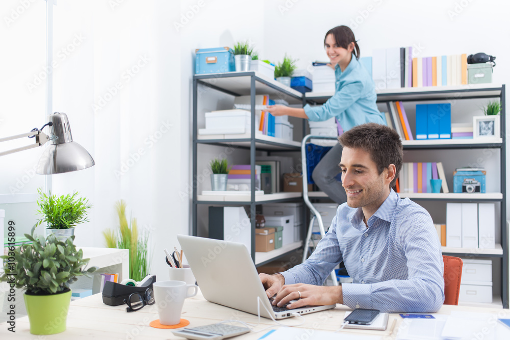 Two people working in the office Two people working in the office