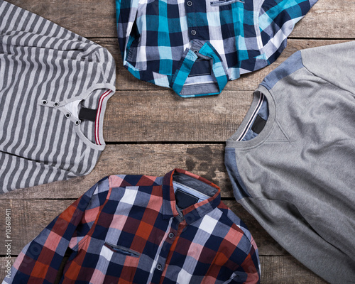Men's clothes on wooden background