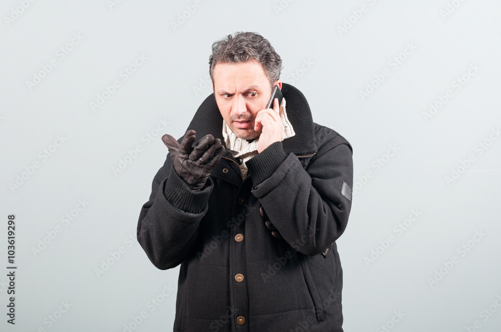 Nervous male having a conversation on cellphone Nervous male having a conversation on cellphone