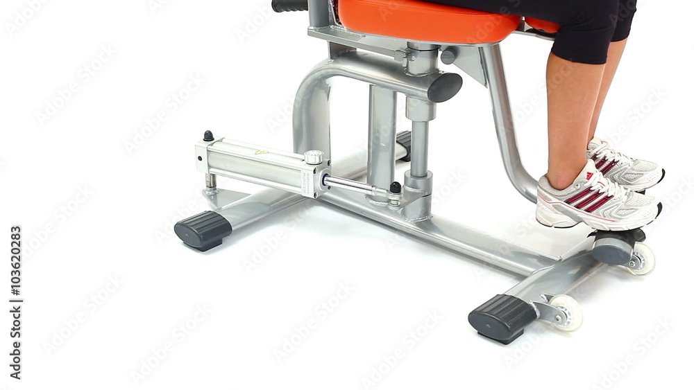 Fragment of young woman on hydraulic exerciser Fragment of young woman on hydraulic exerciser