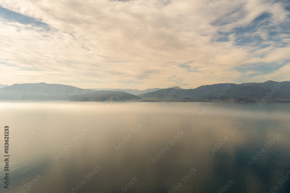 Dramatic landscape of the mountains, the sea and the fog at Nafplio in Greece. View from Palamidi castle.
